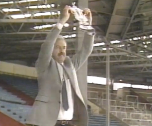 Des Lynam rocks the moustache, sports jacket and home made trophy combo